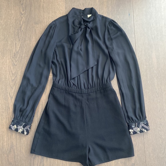 Long Sleeved Black Romper with Embellished Cuffs - Picture 1 of 6